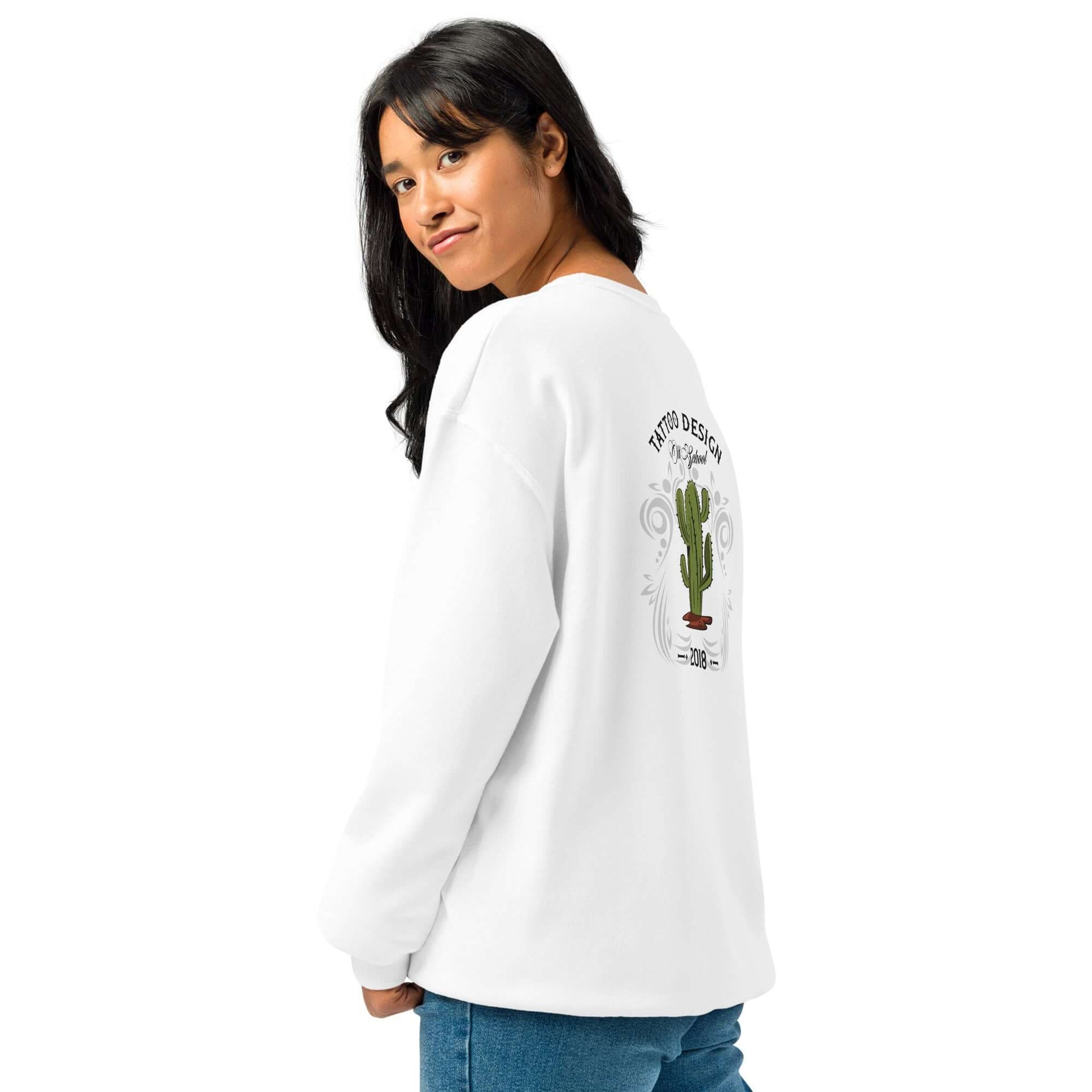 Woman wearing white crew neck sweatshirt with cactus design on back, showcasing relaxed fit and cozy fabric.